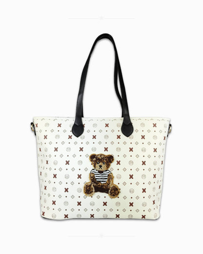 Голяма дамска чанта Teddy Charm Слонова кост и черно – преден изглед на продукта, контрастна комбинация от слонова кост и черни дръжки с декоративно мече, размери 45×30×16 см
